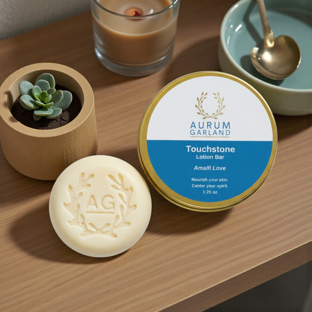 Aurum Garland Touchstone Lotion Bar and container on a wooden surface with a candle and plant in the background.