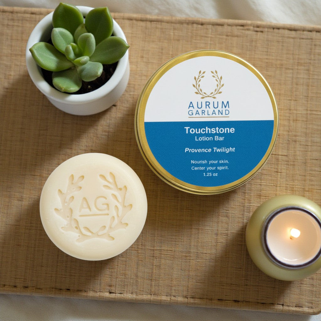 Aurum Garland Touchstone Lotion Bar on a woven mat with a candle and plant.